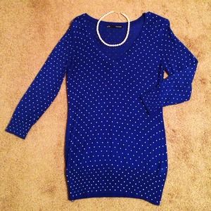 Blue sweater with white polka dots.
