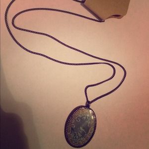 Vintage teal bird portrait necklace.