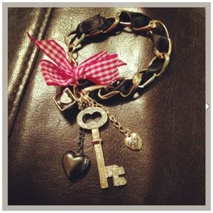 BETSEY JOHNSON. Key/heart/red ribbon bracelet
