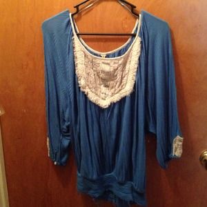 This is a blue and white shirt from Free People.