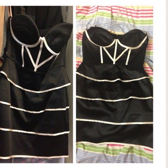 bebe Dresses & Skirts - Bebe mini dress black and white flattering!
