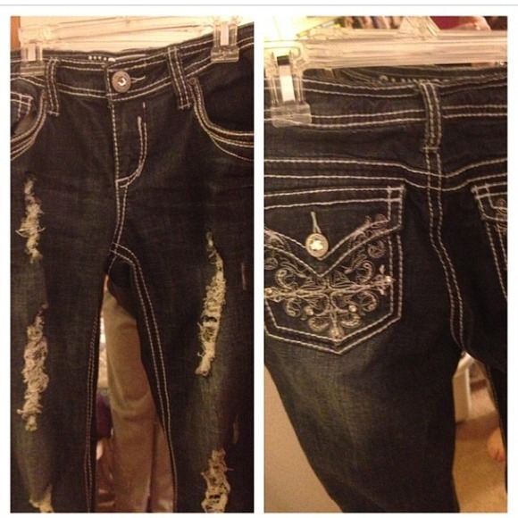 Hydraulic ripped and distressed jeans