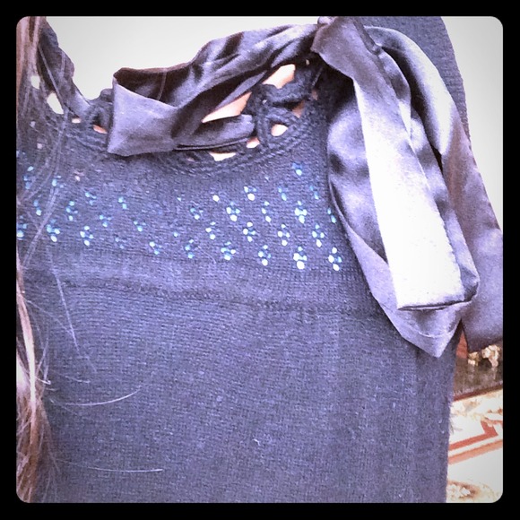 Black dress with macrame and ribbon detailing