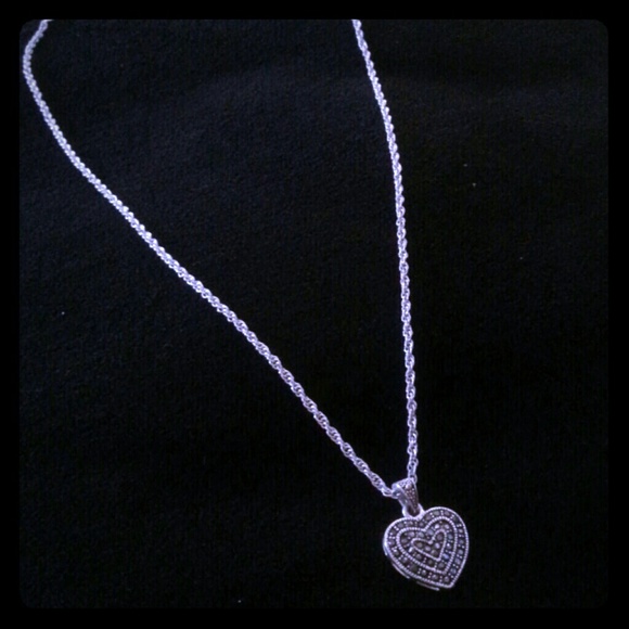 Silver neclace with black diamond heart.