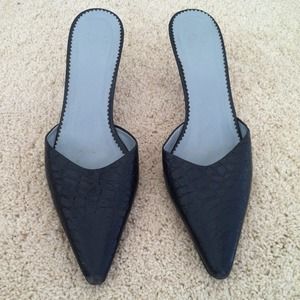BCBG Paris black leather mule pumps in size 7.