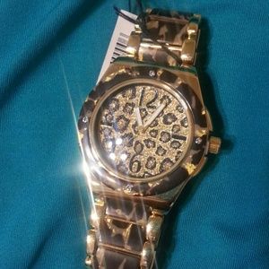 Leopard style and golden tone geneva watch