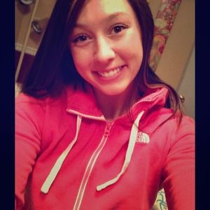 Pink zip-up NorthFace sweatshirt