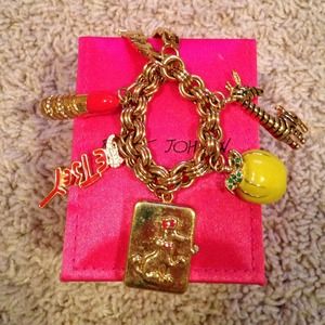 Betsey Johnson watch, charm bracelet.