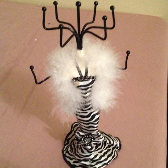 Fashionable zebra print gown jewelry stand.