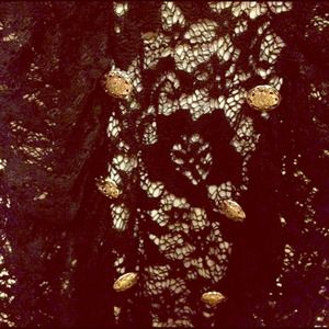 Buckle Boutique lace cowl-neck shirt.