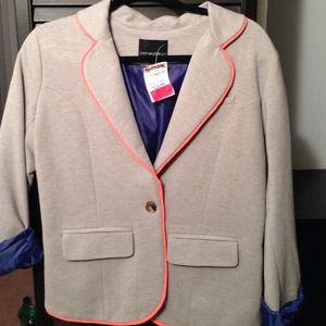 Grey one button blazer with melon trim. Two pocket