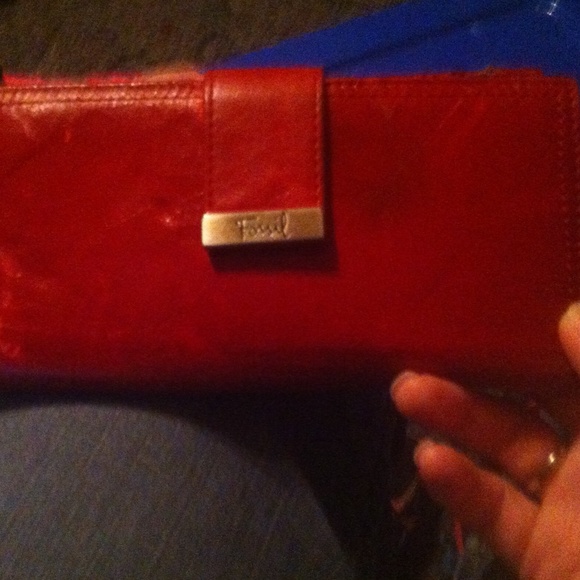 It is a cute red fossil wallet