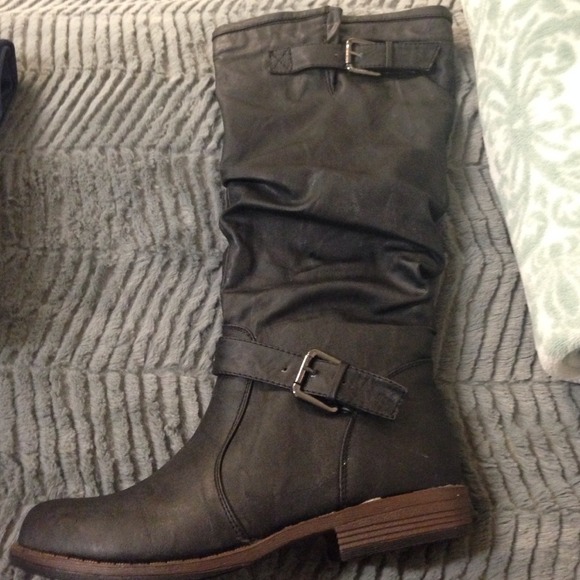 Black leather tall boots.