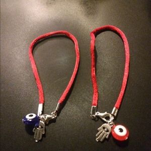 Evil eye charm bracelet with hamsa hand.