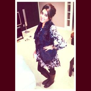 Black fur vest in the picture , super comfy