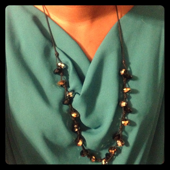 Long cord necklace w/ tri-color large beads.