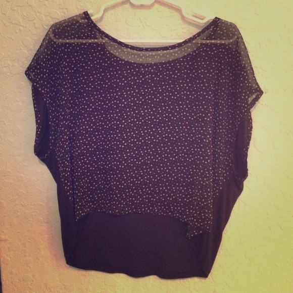 Polka dot top with sheer front and solid back.