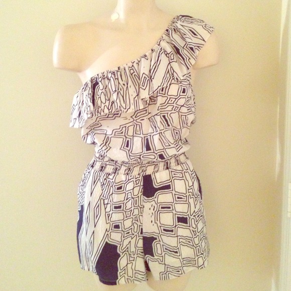 White and navy one shouldered romper.