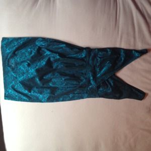 Dark teal dress with black design