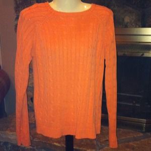 Light orange colored sweater. Size med.