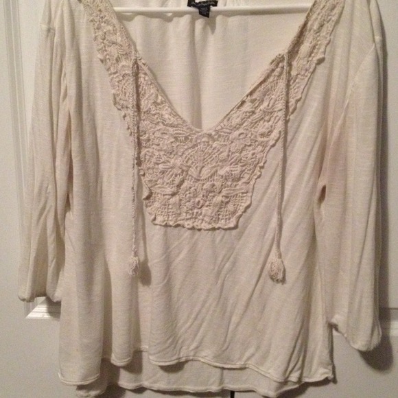 Off white long sleeve top.