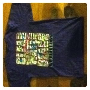 Purple t-shirt.