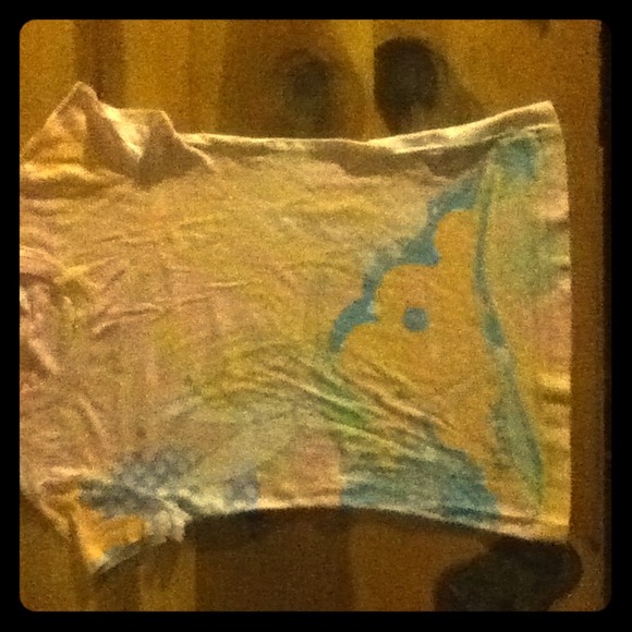 Light pink shirt.