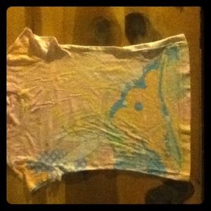 Light pink shirt.
