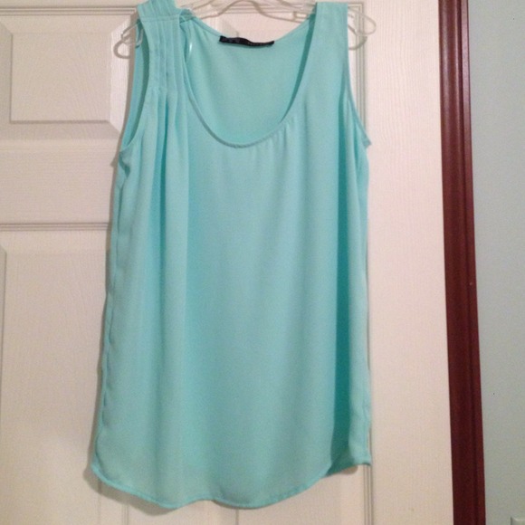Light blue sleeveless blouse