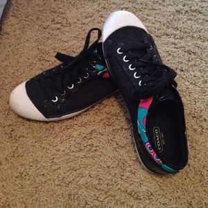 Black coach shoes with a little bit of color