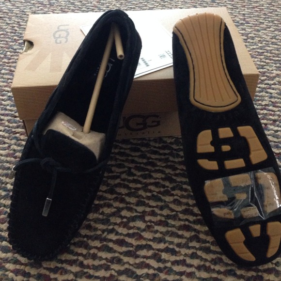 New, never worn, size 7 black UGG shoes with tie