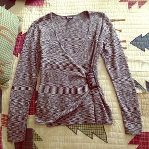 Grey patterned sweater.