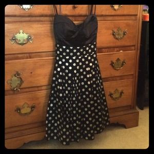 Black and white polkadot flare out dress.