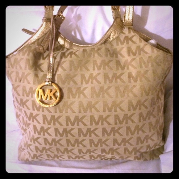 PRICE REDUCTION. Price Firm.Gold Michael Kors Bag.