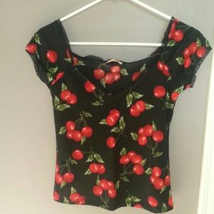 Black semi-sheer top with cherry bunch print