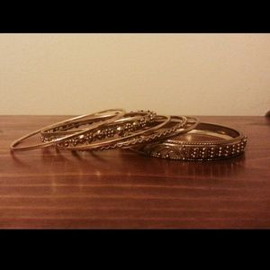 Collection of gold tone bangles
