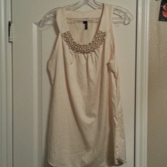 Dressy cream colored top with pearl beading.