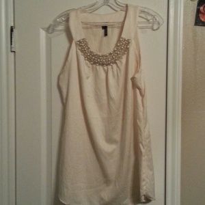 Dressy cream colored top with pearl beading.
