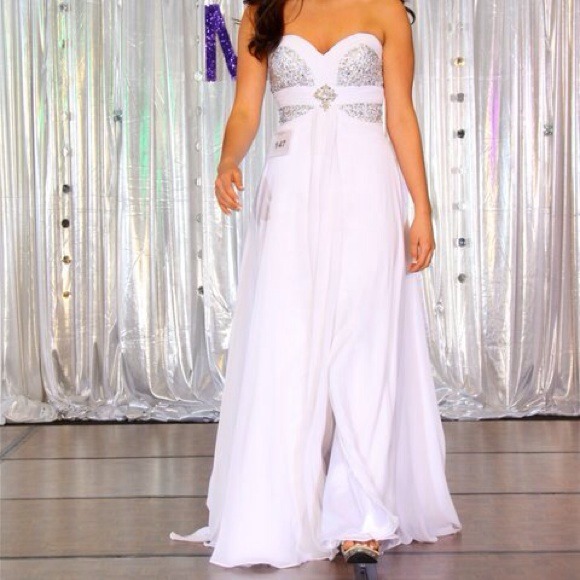 A white evening gown with beautiful beading.