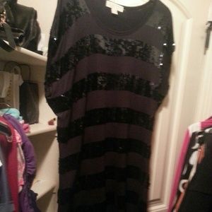 Black t shirt style with black sequence dress