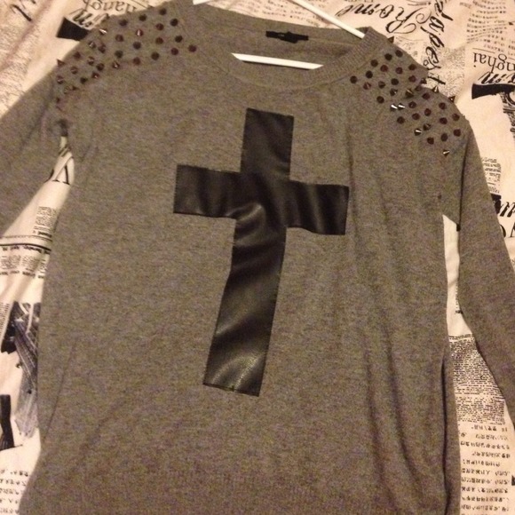 Oversized cross sweater with studs on shoulder