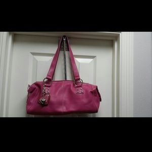 Pink faux leather bag and matching cosmetic case
