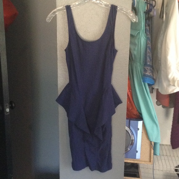 Navy blue body con dress with peplums. NEVER WORN.