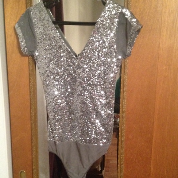 Silver sequin top. buttons from the bottom