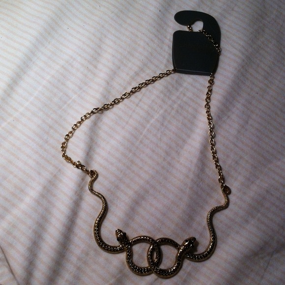 Brand new Charlotte Russe gold snake necklace