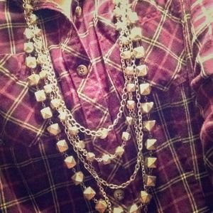 Edgy Multi strand gold tone necklace