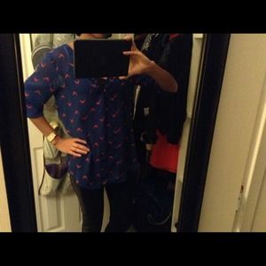 Blue flowy shirt with red bird pattern