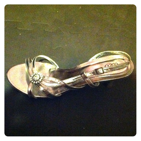 Silver 1" open toe heels.