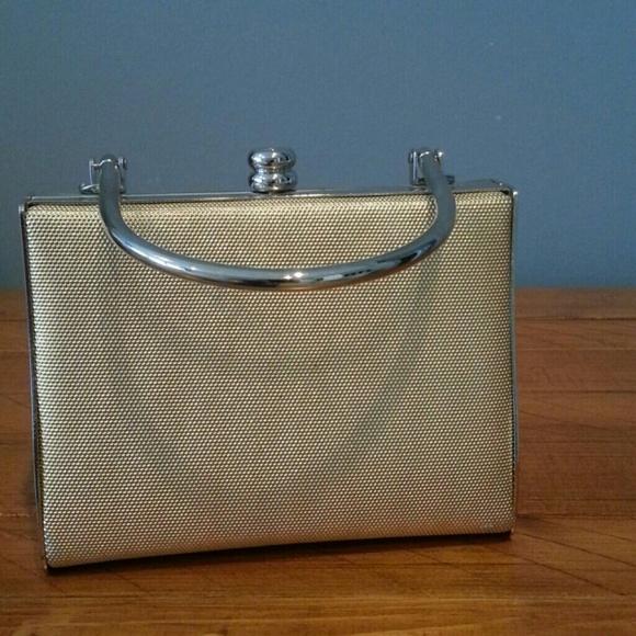 Silver and gold hard metal clutch with handle
