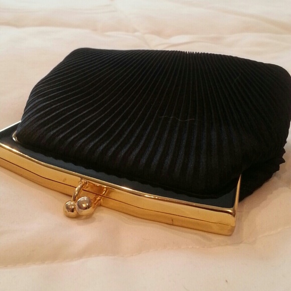 Small ribbed black satin clutch with snap closure
